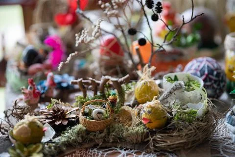A chickadee sits in a nest. Easter decoration for your home. Stock-Fotos
