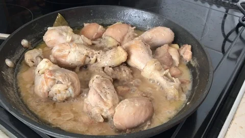 Chicken adobo cooking in a pan Stock Footage 104817593