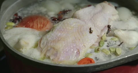 Chicken and aromatic spices begin to simmer for broth Vídeo Stock 329790110
