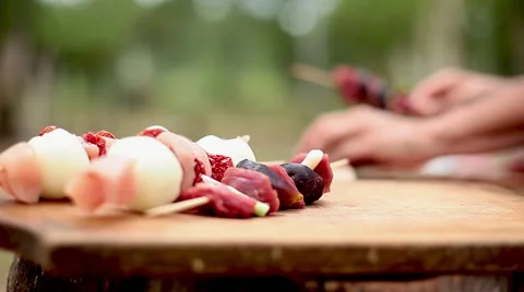 Chicken and beef kebabs assembled and ready to grill Stock Footage 63305654