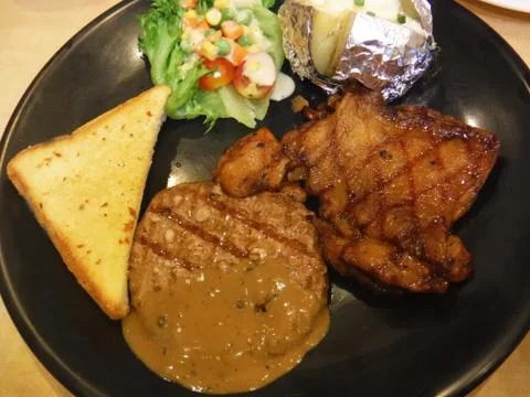 Chicken and beef steak Stock Photos