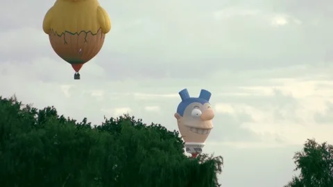 Chicken and comical face hot air balloon Stock Footage 79172891