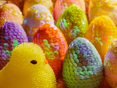 Chicken and Easter multi-colored eggs with handmade sequins. Stock Photos