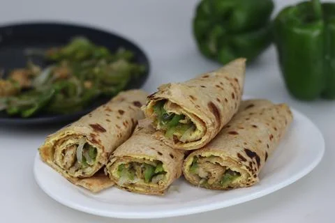 Chicken and egg wrap or Egg chicken roll. Stir fried bell peppers and mince.. 写真素材