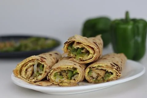 Chicken and egg wrap or Egg chicken roll. Stir fried bell peppers and mince.. 写真素材