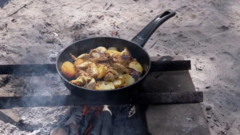 Chicken and potatoes fried on fire Stock Footage 293277670