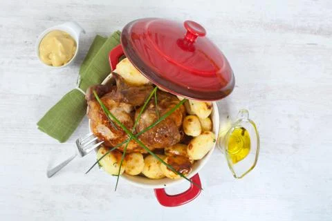 Chicken and potatoes Stock Photos