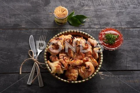 Chicken barbecue on wooden table Stock Photos