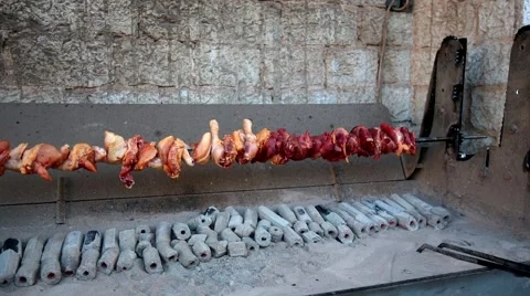 A chicken barbecued on a rotating spit, grill Stock Footage 51121386