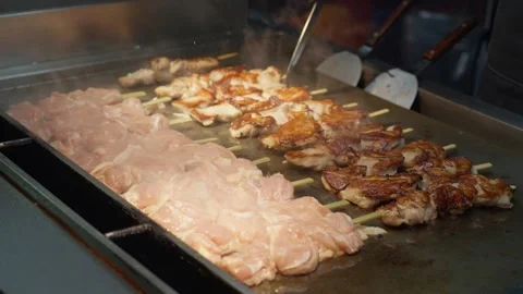 Chicken BBQ is cooked and served at night market at Taipei, Taiwan - 4k Stock Footage 295235211