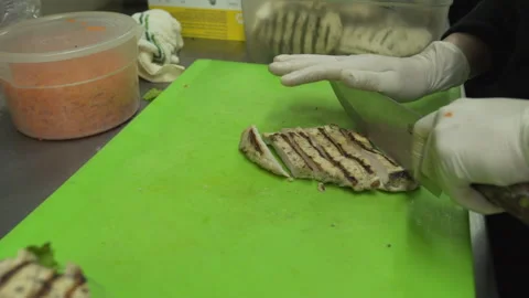 Chicken being cut in restaurant kitchen Stock Footage 142158493