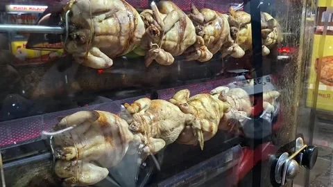 Chicken being roasted in a roasting machine Stock Footage 329458461