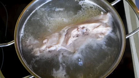 The chicken boiling in water at a maximum temperature of Stock Footage 93769540