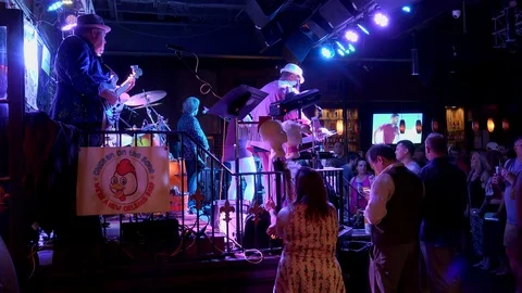 'Chicken On The Bone' band live performance in the  Bourbon Bandstand stage. Stock Footage 125042205