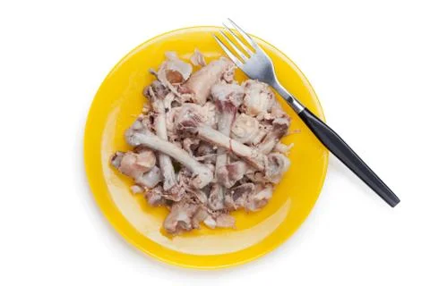 Chicken bones on plate Stock Photos