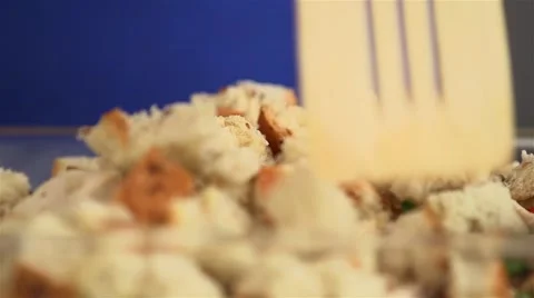 Chicken bread pudding being mixed before cooking. Video stock 55114099