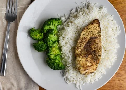 Chicken  breast and rice  served with broccoli Stock Photos