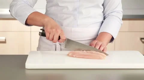 Chicken breast being diced Stock Footage 24657812