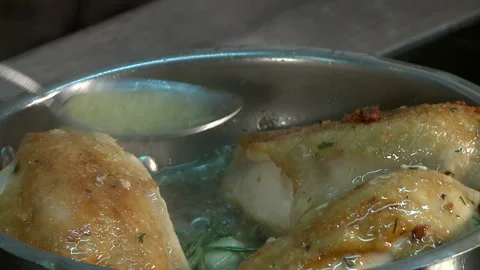 Chicken breast fried in a pan in boiling oil Stock Footage 121910032