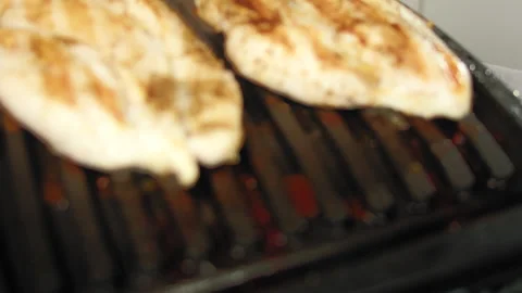 Chicken breasts cooked on grill Video stock 165973810