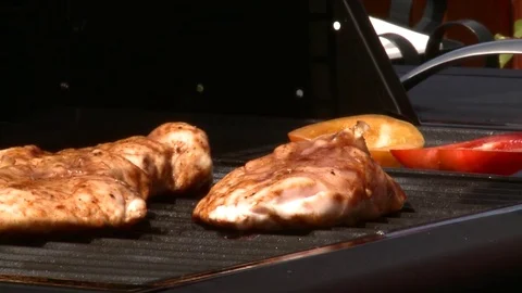 Chicken breasts penciled on the BBQ Stock Footage 84992027