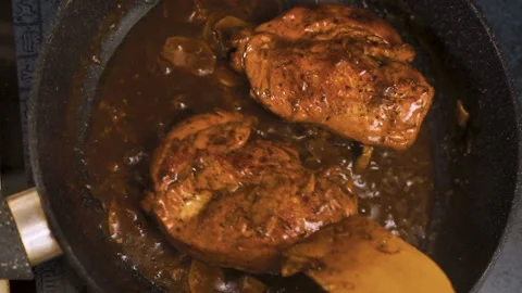 Chicken breasts with spicy chilli sauce in a saucepan top view video Video stock 85757019