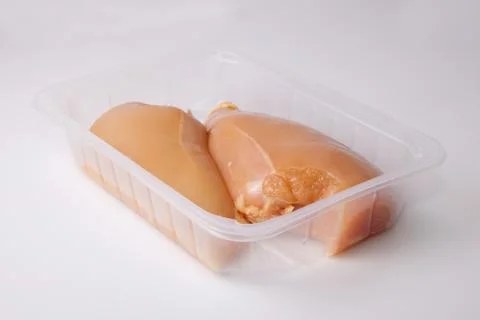 Chicken breasts on tray Stock Photos