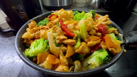 Chicken, broccoli, pepper and cauliflower stir-fry Stock Footage 324713468