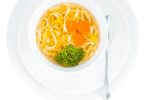 Chicken broth on white background. Фото
