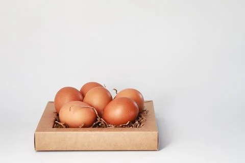 Chicken brown eggs on a white table Stockfoto's