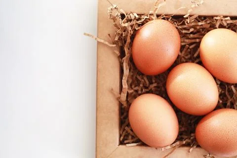 Chicken brown eggs on a white table Stockfoto's