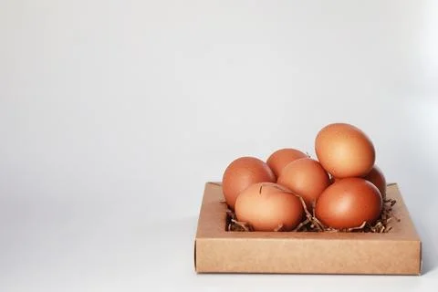 Chicken brown eggs on a white table Stockfoto's