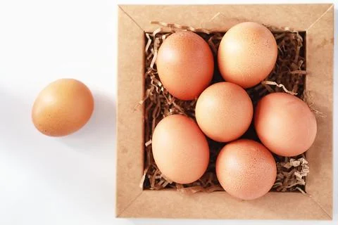 Chicken brown eggs on a white table 写真素材
