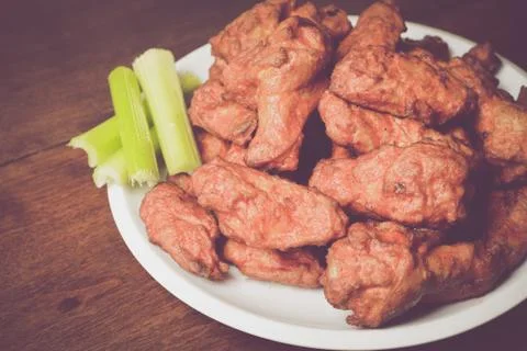 Chicken Buffalo Wings with Celery Sticks Stock Photos
