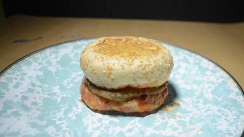 A chicken burger cut off into two pieces stock footage Stock Footage 275630692