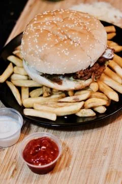 Chicken burger on the fires Stock Photos