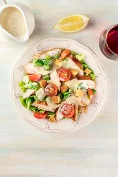 Chicken Caesar salad on light background with copyspace Foto stock