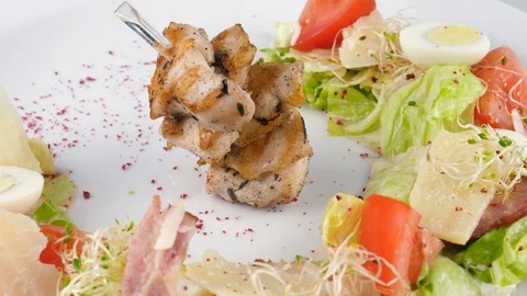 Chicken Caesar salad, original design, served in restaurant Stock Footage 94210444