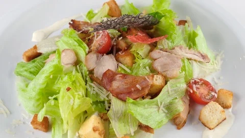 Chicken Caesar Salad with parmesan cheese, bacon and croutons Video stock 80982163