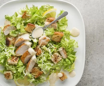 Chicken Caesar Salad with roasted bread Stock Photos