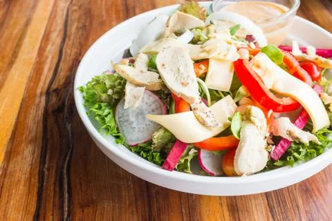 Chicken cheese salad with caesar dressing Stock Photos