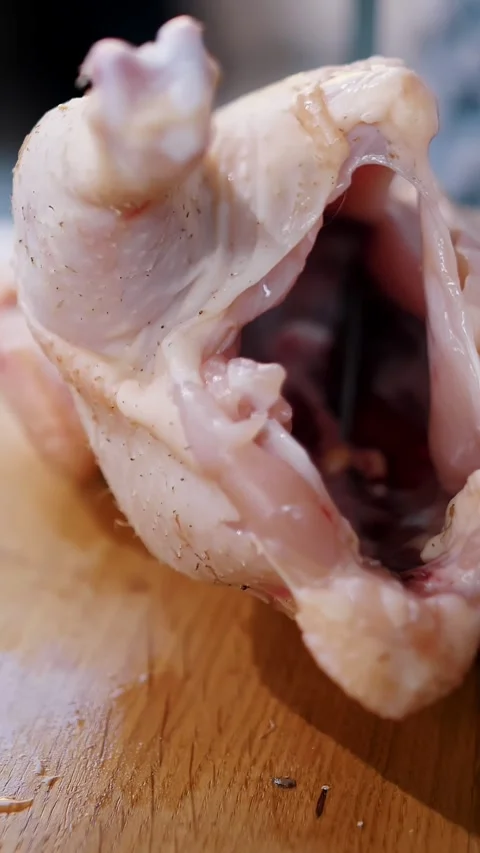 Chicken. Chef preparing food. close-up. top view. Butcher is chopping a fresh Stock-Footage 315562434