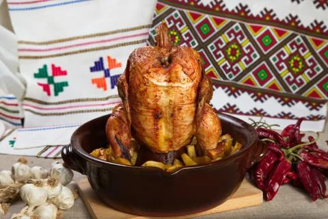 Chicken cooked in the oven on a ceramic base. 写真素材