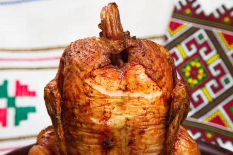 Chicken cooked in the oven on a ceramic base. Stock Photos