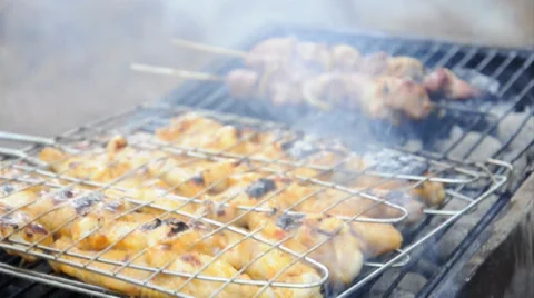 Chicken cooking on a barbecue grill Stock Footage 32868931