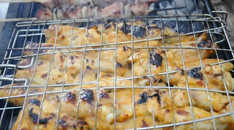 Chicken cooking on a barbeque grill Stock Footage 32869518