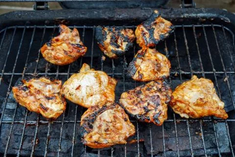 Chicken cooking on a BBQ Stock Photos
