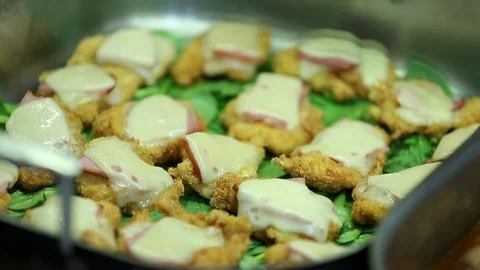Chicken cordon bleu blue mini pieces with cheese at buffet 1 Stock Footage 123875664