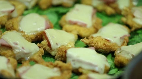 Chicken cordon bleu blue mini pieces with cheese at buffet 2 Stock Footage 123875674