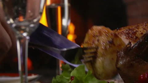 Chicken cut with knife on the background of fire Stock Footage 120979207